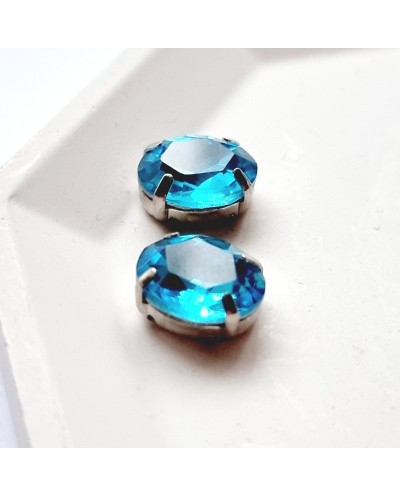 Ovalūs prisiuvami kristalai žydros sp., 12x10mm, 1 vnt.